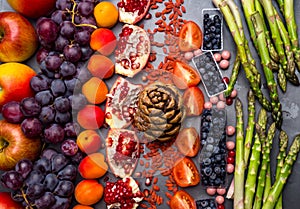 Health food for fitness concept with fruit, vegetables, nuts High in anthocyanins, antioxidants, minerals and vitamins