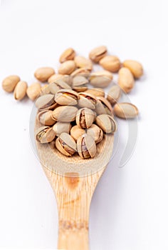 Health Food Pistachios on a Wooden Spoon