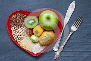 Health food on a red heart plate diets abstract still life