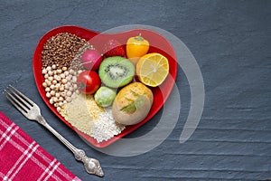 Health food on a red heart plate diets abstract still life