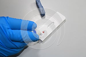 Health hand performing a covid-19 antigen test