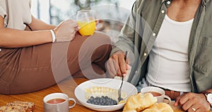 Health, hands and couple eating breakfast with fruit, coffee and juice at table for wellness diet. Food, wellness and