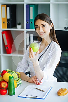 Health. Healthy Diet. Doctor Dietitian Holding in Hands Fresh Gr