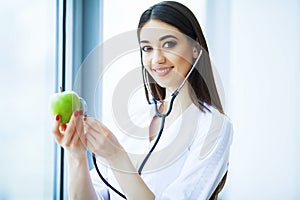 Health. Healthy Diet. Doctor Dietitian Holding in Hands Fresh Gr