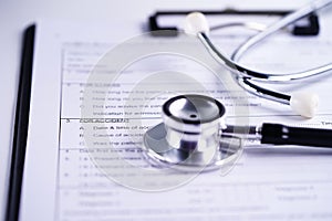 Health insurance accident claim form with stethoscope, Medical concept.