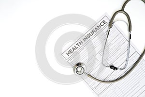 Health insurance application form and stethoscope