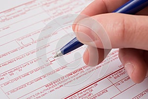 Health insurance claim form and pen