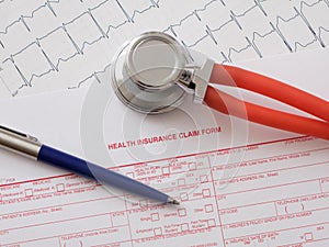 Health insurance claim form with stethoscope