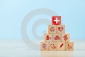 Health Insurance Concept,arranging wood block stacking with icon healthcare medical