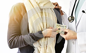 Health insurance concept, Patient paying doctor for medical service with money dollar banknote.