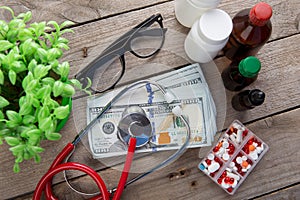 health insurance concept - stethoscope over the money