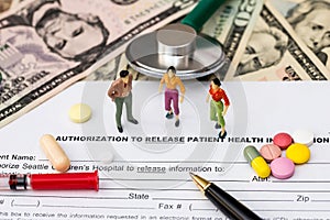 Health insurance form with stethoscope , pills and dollar