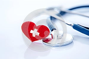 Health  insurance and Medical Healthcare heart disease concept , a red heart shape with stethoscope on white background
