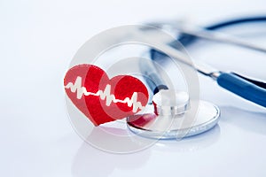 Health  insurance and Medical Healthcare heart disease concept , a red heart shape with stethoscope on white background