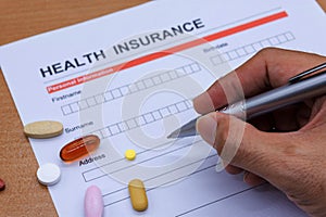 Health insurance paperwork, medicine, stethoscope. Health insurance claim concept.