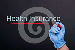 Health insurance text written by doctor hand