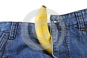 Health and male sexuality concept - banana out of men`s jeans like mens penis