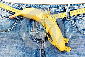 Health and male sexuality concept: jeans crotch and banana photo