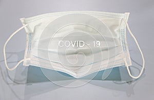 Health mask to prevent germs that wrote a message from Covid - 19