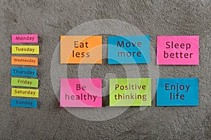 Health and motivation concept - Many colorful sticky note with words eat less, move more, sleep better, be healthy, positive