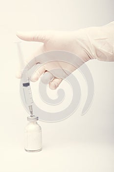 Health nurse worker with vaccine syringe. Concept vacine for healty lifestyle. Toned Image