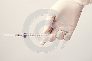 Health nurse worker with vaccine syringe. Concept vacine for healty lifestyle. Toned Image