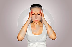 Health and pain. Young woman having strong tension headache. Closeup portrait of beautiful sick girl suffering from head migraine