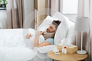 sick man sleeping in bed at home