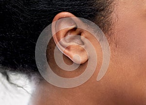 Close up of young woman ear photo