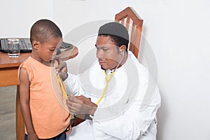 Health professional examining a child