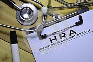 Health Reimbursement Account HRA text on Document form isolated on office desk.