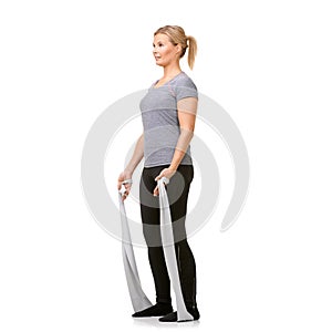 Health, resistance band and woman doing exercise in studio for fitness, wellness and bodycare. Sports, full length and