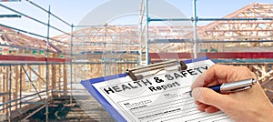 Health and Safety Report Banner hand with clipboard beside new build construction