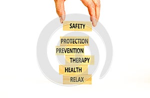 Health and safety symbol. Concept words Safety Protection Prevention Therapy Health Relax on wooden blocks on a beautiful white