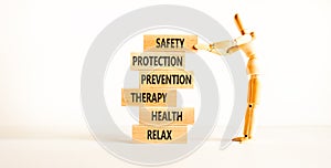 Health and safety symbol. Concept words Safety Protection Prevention Therapy Health Relax on wooden blocks on a beautiful white