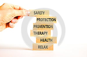 Health and safety symbol. Concept words Safety Protection Prevention Therapy Health Relax on wooden blocks on a beautiful white