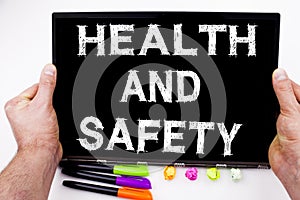 Health and Safety text written on tablet, computer in the office with marker, pen, stationery. Business concept for Awareness Stan