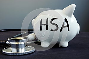 Health Savings Account HAS written on a piggy bank. photo