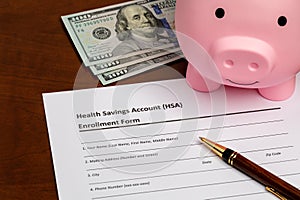 Health savings account, HSA, form with piggy bank and cash money.