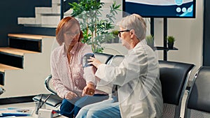 Health specialist measuring hypertension and blood pressure
