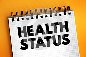 Health Status - individual`s relative level of wellness and illness, text concept on notepad