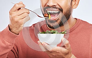 Health studio, man and mouth eating salad, vegetables or green food product for weight loss, healthy lifestyle or