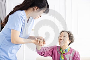 Health visitor and a senior woman during home visit