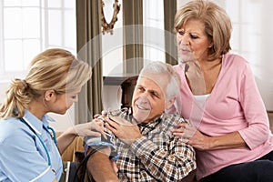 Health Visitor Taking Senior Man's Blood Pressure photo