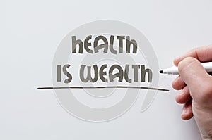 Health is wealth written on whiteboard