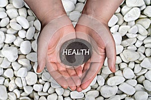 Health word in stone on hand