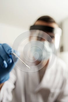 Health worker taking a nasopharyngeal culture photo