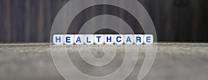 Healthcare boggle word cubes on dark background