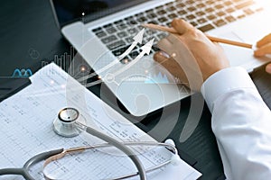 Healthcare business graph and Medical examination and businessman analyzing data and growth chart on laptop background