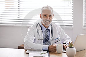 Healthcare, coffee and portrait of doctor on laptop in office for medical results, research and online consulting